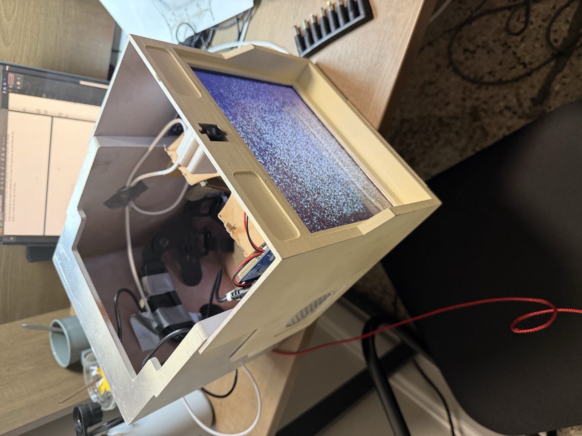 Custom-printed housing with the outward-facing display powered on